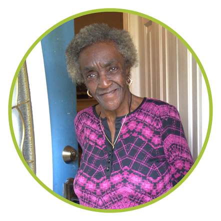 Senior standing in her doorway