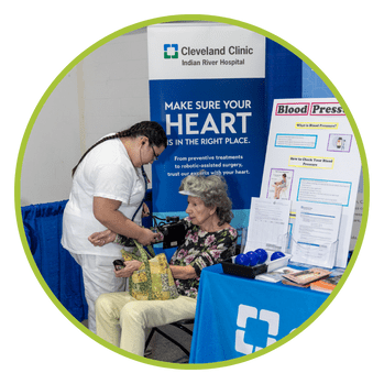 senior expo ccirh Senior having blood pressure checked at Expo booth
