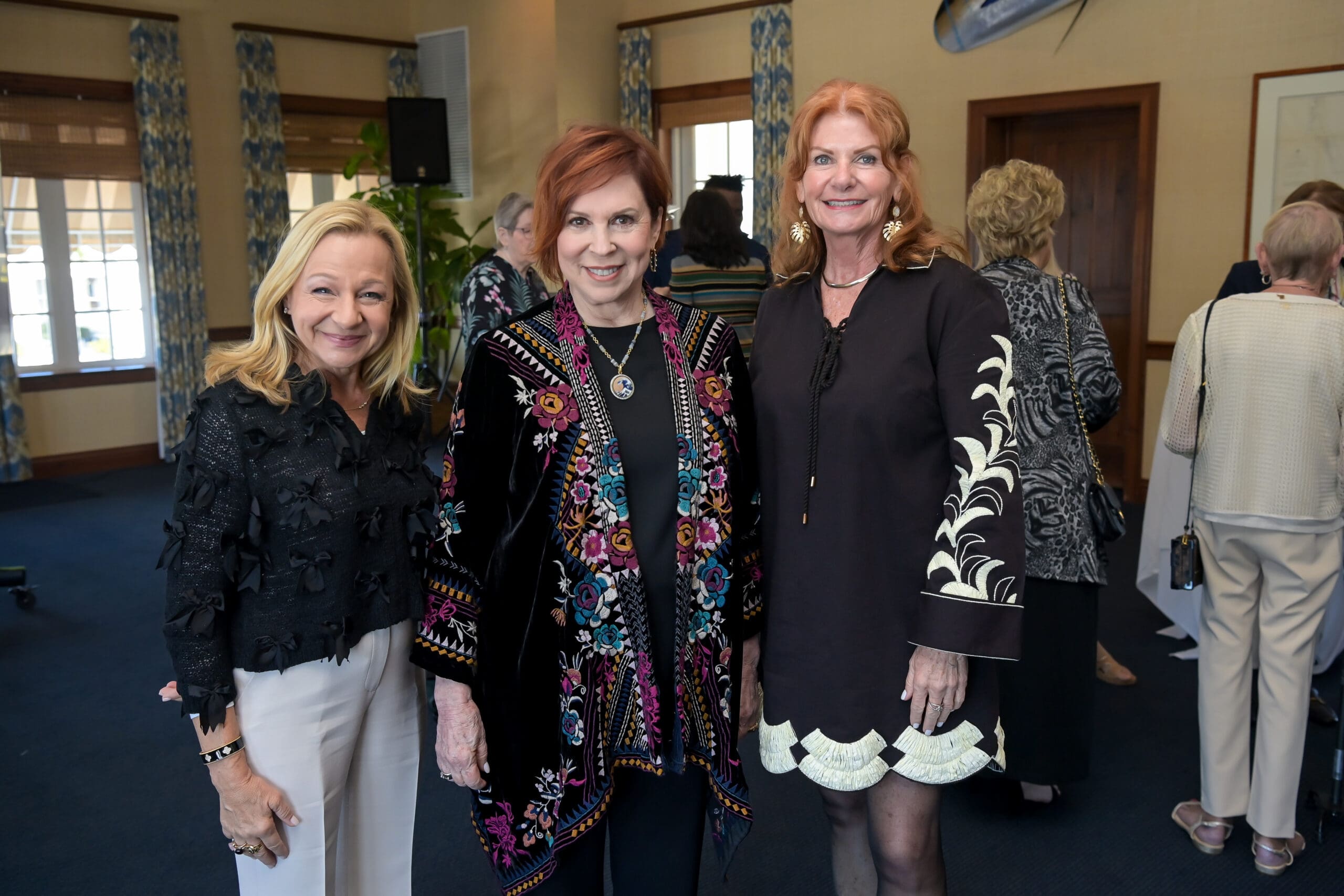 Vicki Lawrence taking a photo with event guests.