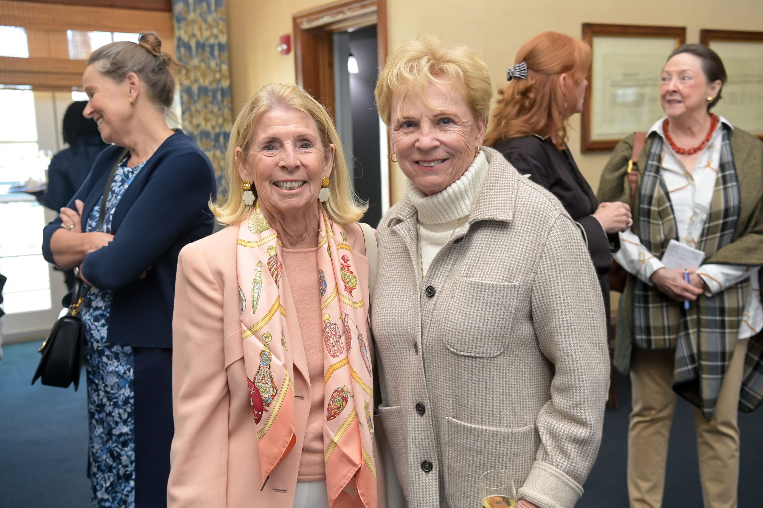 Attendees smiling for a photo at the luncheon.
