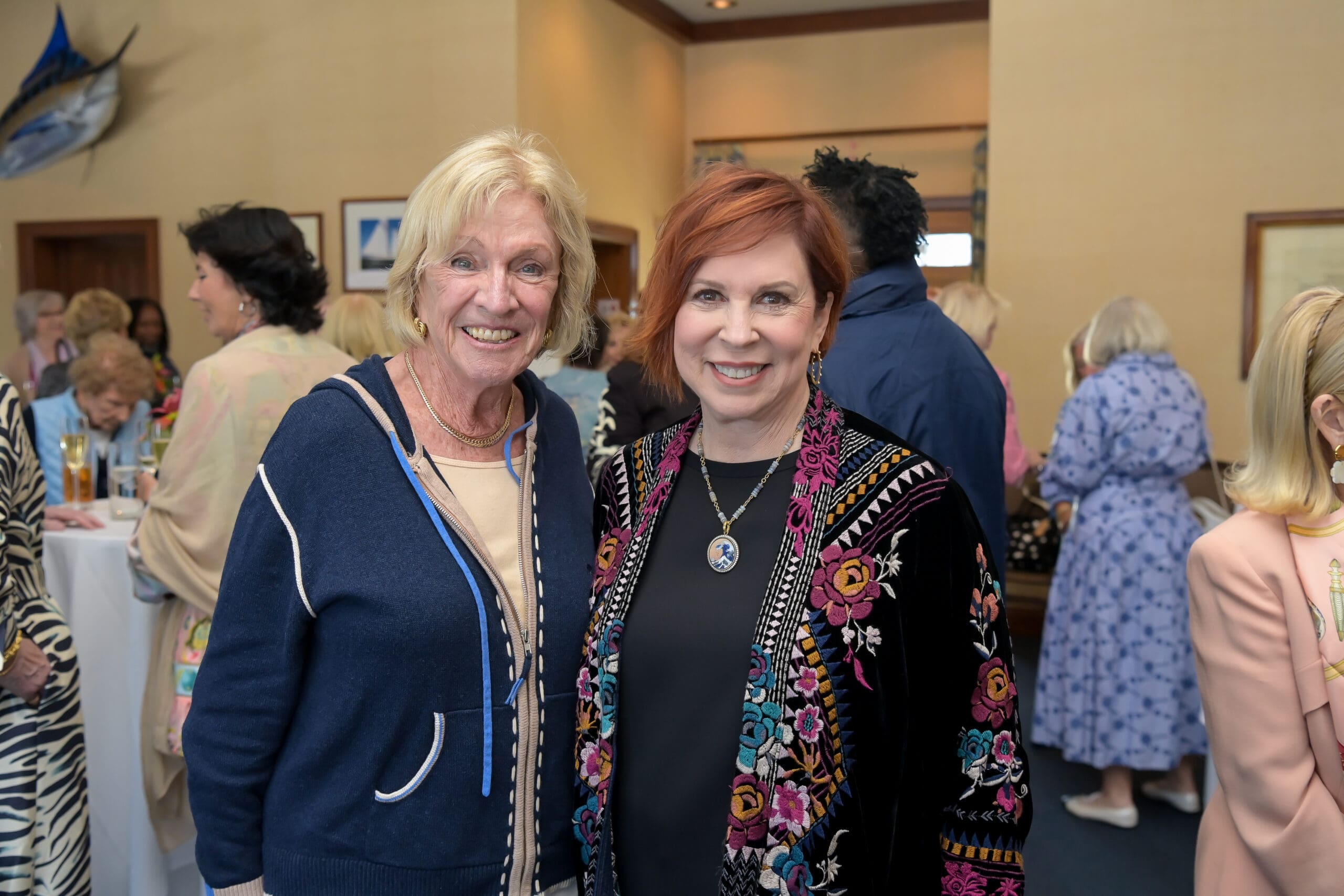 Vicki Lawrence taking a photo with event guests.