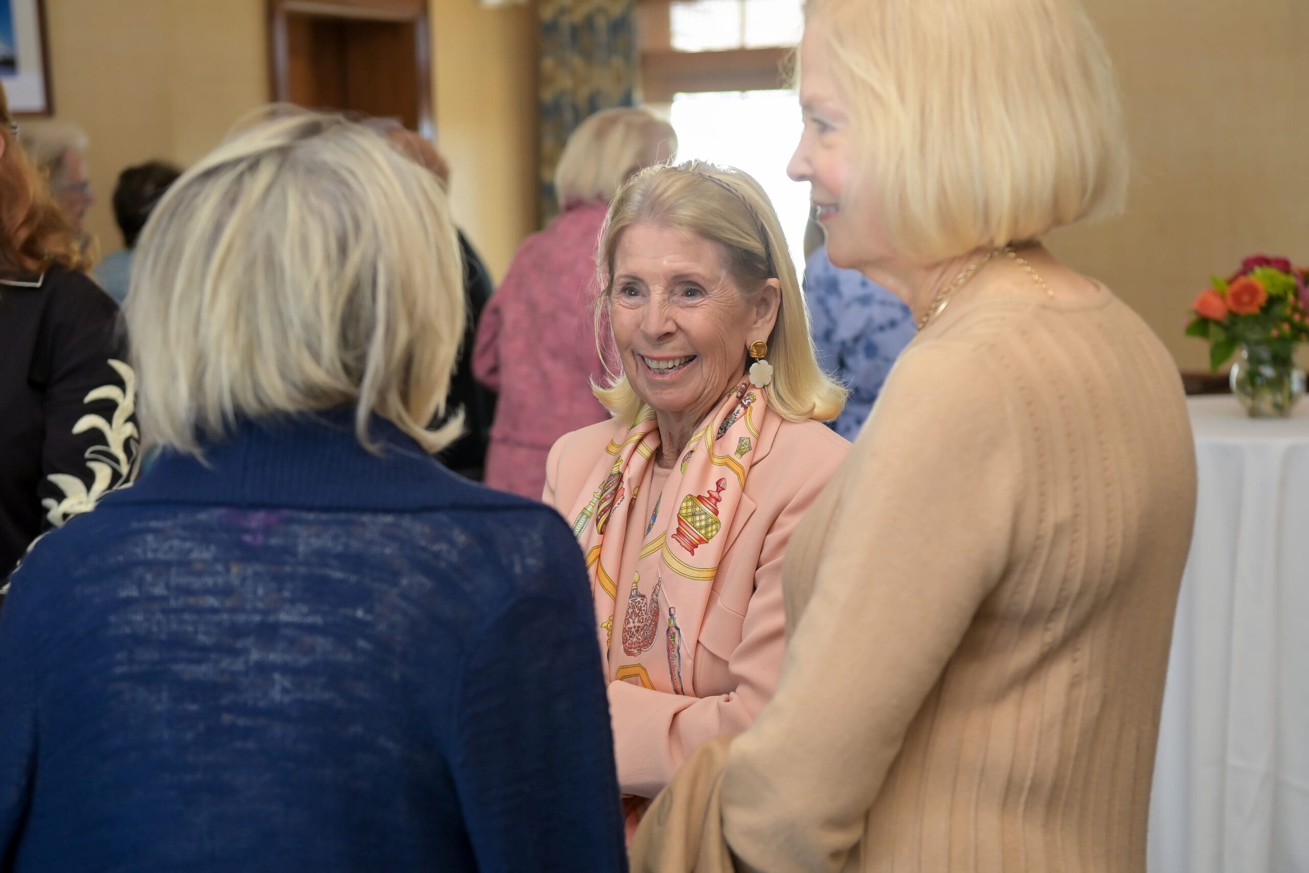 Attendees chatting at the luncheon.