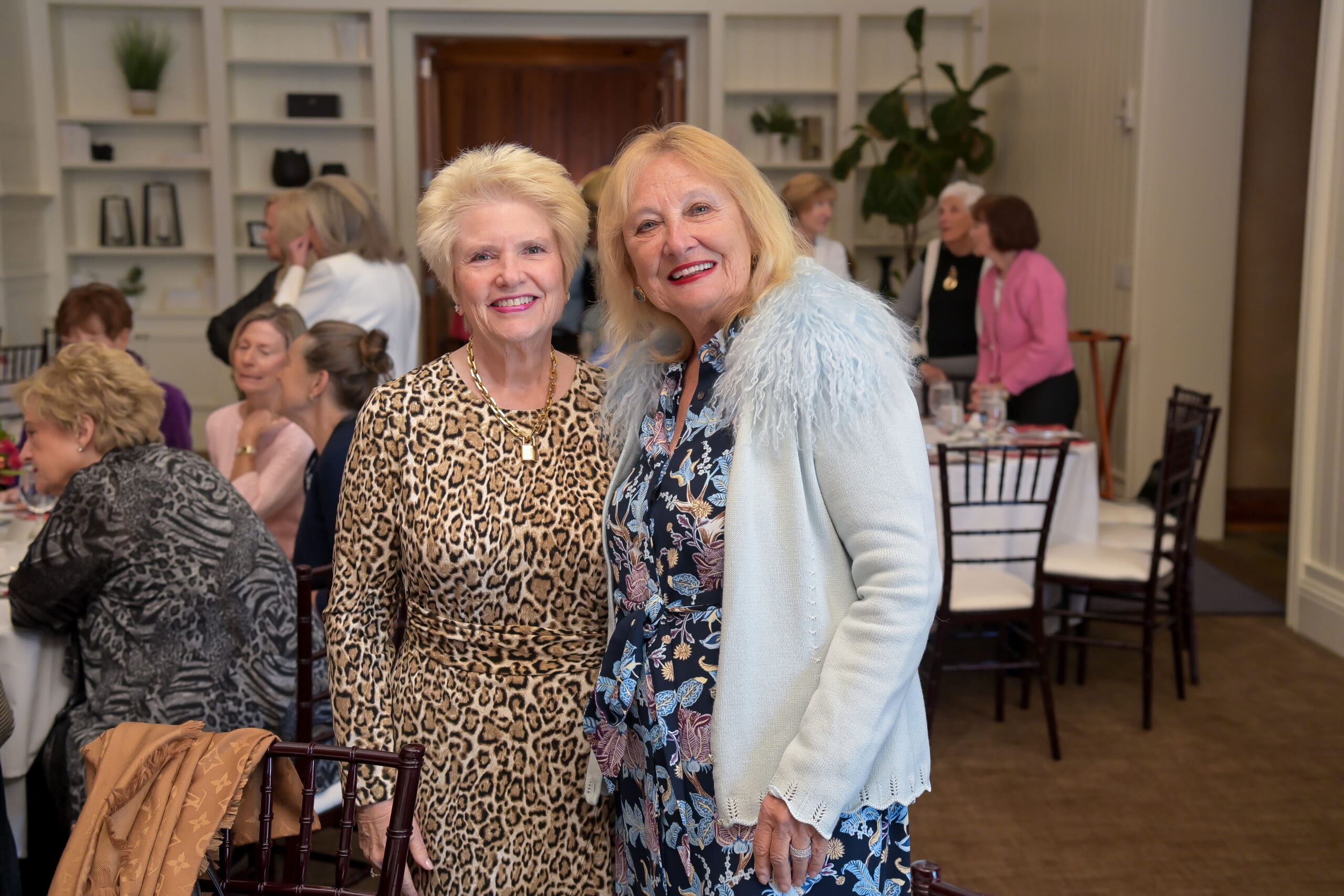 Attendees sharing a moment at the Living Joyfully luncheon.