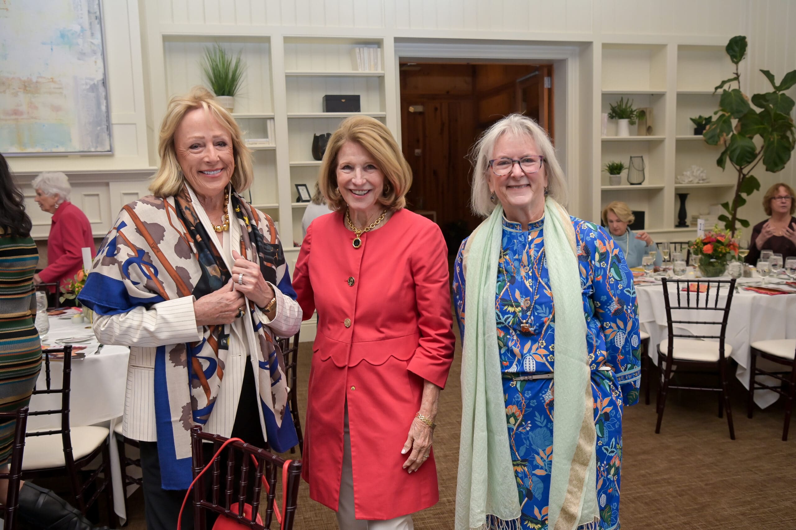 Attendees smiling for a photo at the Living Joyfully event.