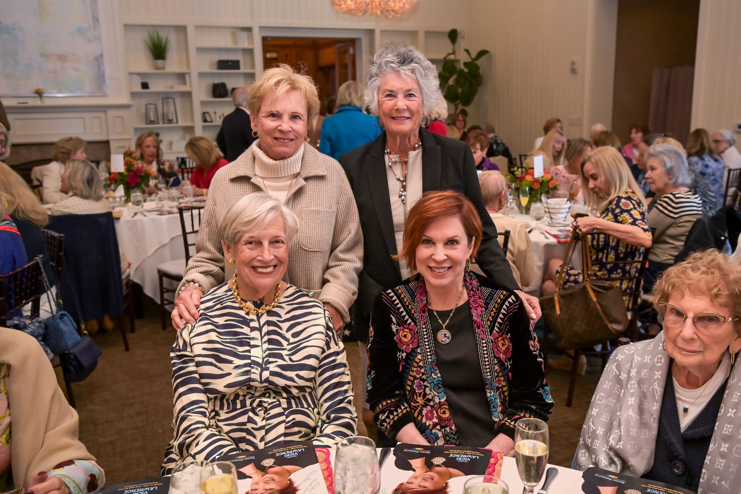 Vicki Lawrence taking a photo with event guests.