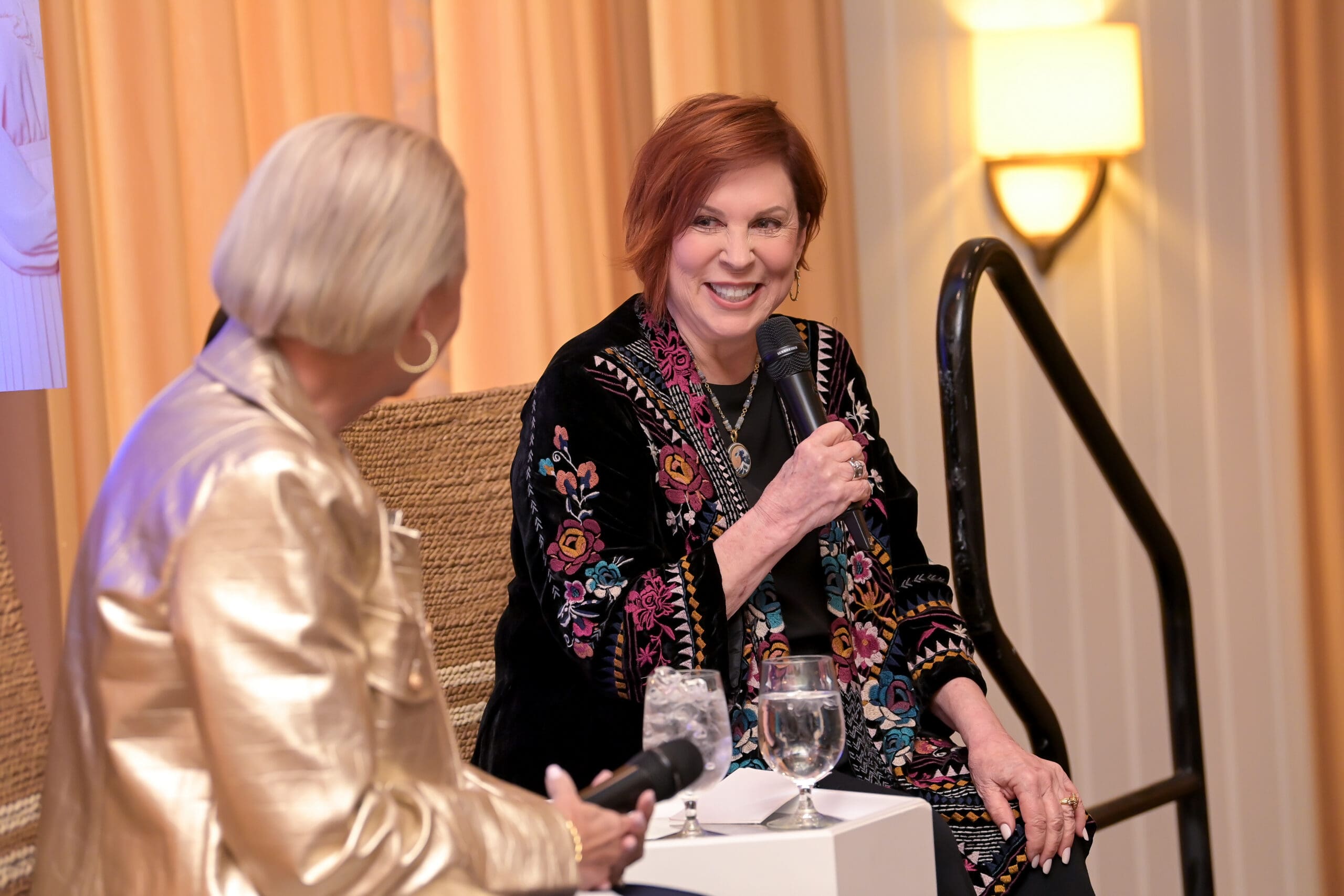 Vicki Lawrence and the event moderator in conversation on stage.