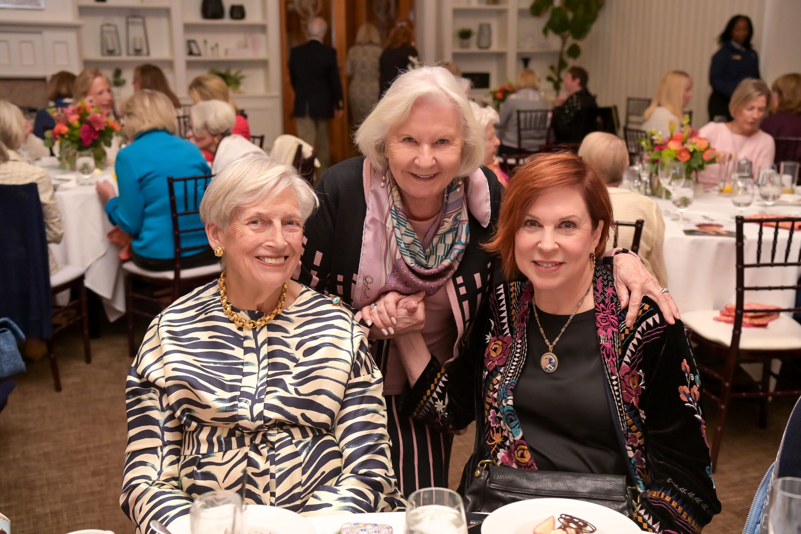 Attendees capturing a moment with Vicki Lawrence at the Living Joyfully event.