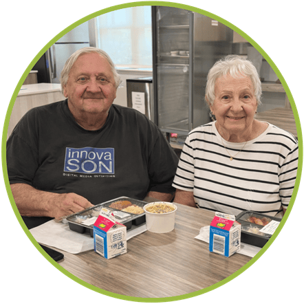 Social Dining Orange Blossom Seniors enjoying a hot meal at a social dining site.