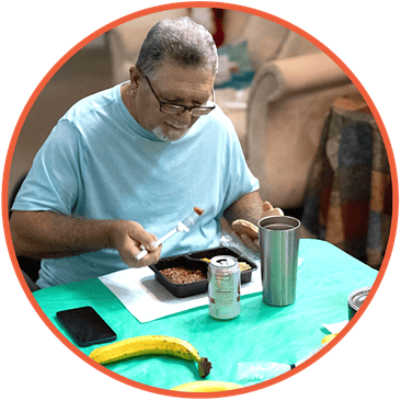 social dining retake A senior enjoying a hot meal at a social dining site.